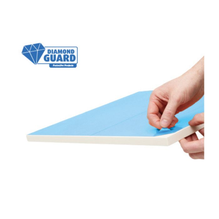 Applying Diamond Guard blue protective film to surface for protection against scratches, dust and damage.